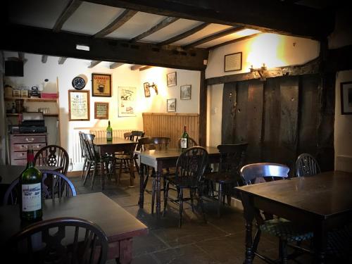a dining room with tables and chairs in a restaurant at The White Horse Inn, Clun in Clun