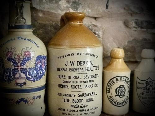 a group of three vases sitting next to each other at The White Horse Inn, Clun in Clun