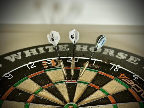 a close up of a dartboard with four darts at The White Horse Inn, Clun in Clun