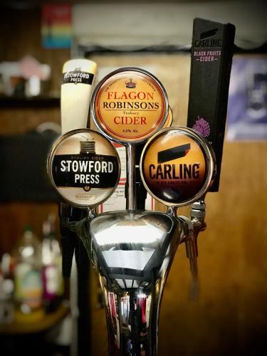 a close up of three different types of parking meters at The White Horse Inn, Clun in Clun