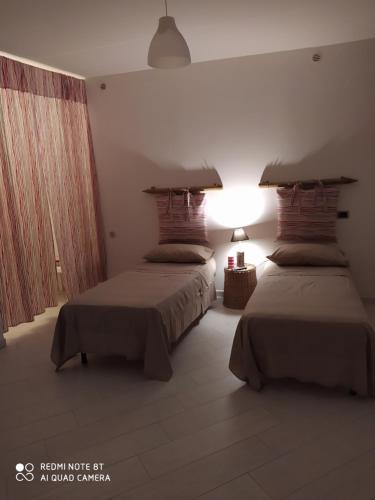 A bed or beds in a room at Una nuova luna ai Camaldoli