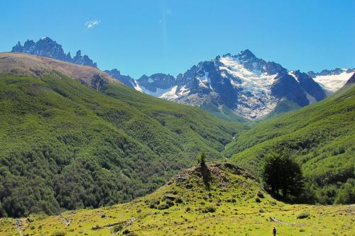 a view of a mountain valley with snow covered mountains at Casa Cerro Castillo in Villa Cerro Castillo