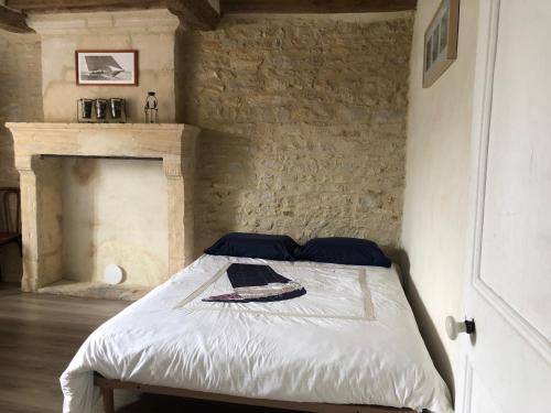 Postel nebo postele na pokoji v ubytování Le petit clos du Bessin