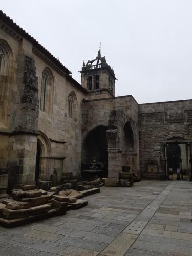 an old stone building with a tower on top of it at Hotel do Parque in Braga