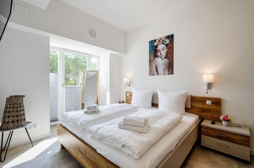 En eller flere senge i et værelse på FeWo Prora - Proras Strandhaus