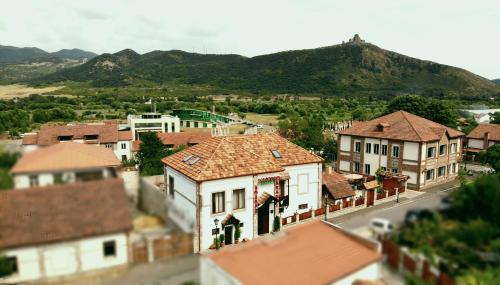 an aerial view of a town with houses and mountains at Hotel Aragvi in Mtskheta
