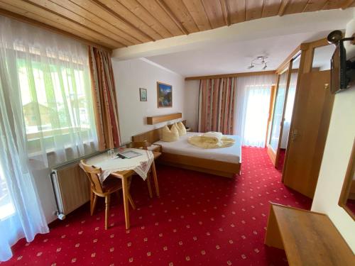 Postel nebo postele na pokoji v ubytování Hotel UNTERKRÄMERHOF