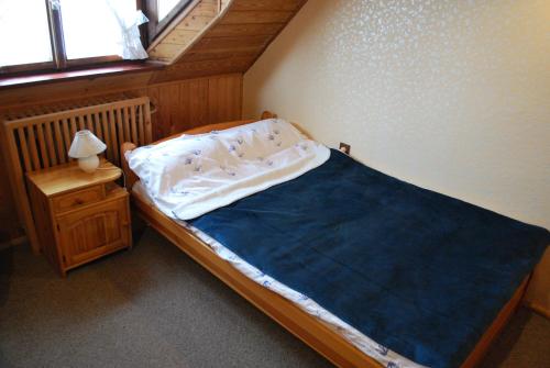 Кровать или кровати в номере Jabłoniowy Dworek Kociewie