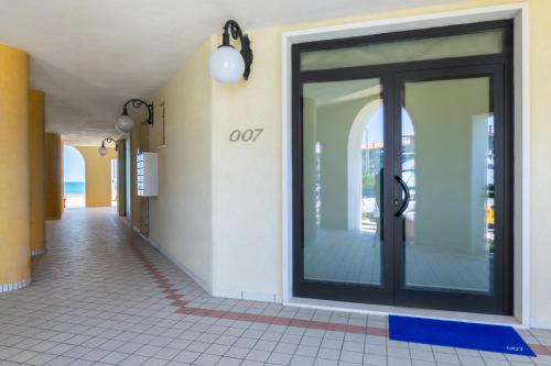 an empty hallway with a door in a building at Life Hotel Seaview & Spa in Porto Recanati