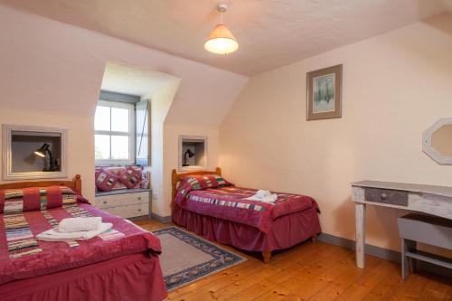 Ένα ή περισσότερα κρεβάτια σε δωμάτιο στο Kilmore Cottages Self - Catering