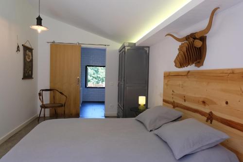En eller flere senge i et værelse på Casa Carmina Hostel