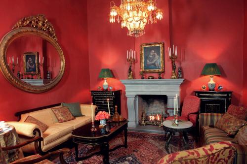 a living room with a couch and a fireplace at Casa Misha in San Miguel de Allende