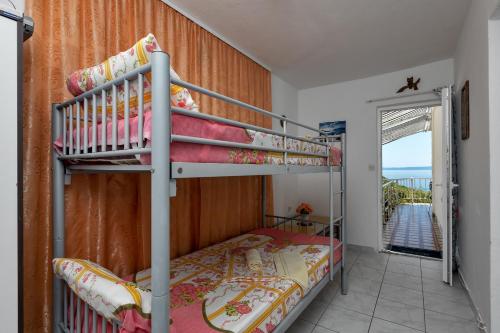 Postel nebo postele na pokoji v ubytování Vila Milena