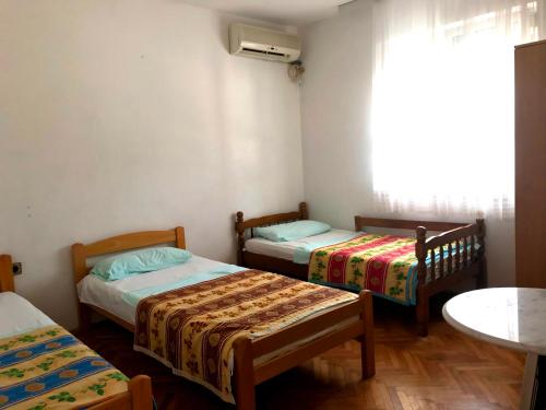 Postel nebo postele na pokoji v ubytování Apartments KRAJA