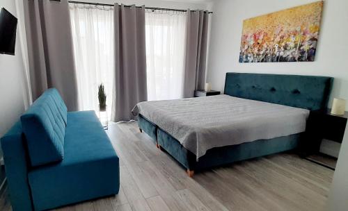 Łóżko lub łóżka w pokoju w obiekcie Flamingo Apartments