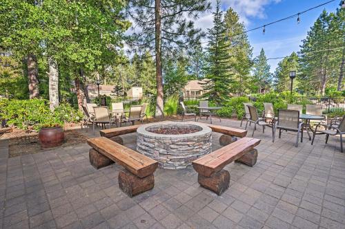 a patio with two benches and a fire pit at Bend Condo with Deck, Resort-Style Amenities and Views in Bend