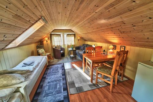a room with a bed and a table in a room at Nora Gård in Åndalsnes