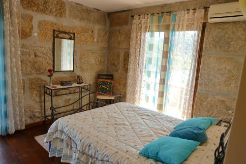 En eller flere senge i et værelse på Casa Vista Alegre