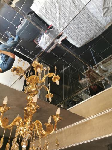 a gold chandelier is hanging from a ceiling at Chic Apartment 2 in Sharm El Sheikh