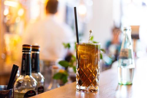 a drink sitting on top of a table at Hotel Achterum Greetsiel in Greetsiel