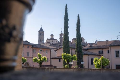 a view of a town with trees and buildings at Città Di Castello Rooms in Città di Castello