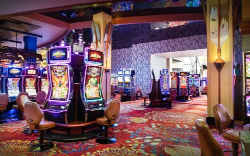 a casino with many slot machines in a room at Seneca Niagara Resort & Casino in Niagara Falls