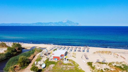 an aerial view of a beach with tables and chairs at Hotel Pontos in Sarti