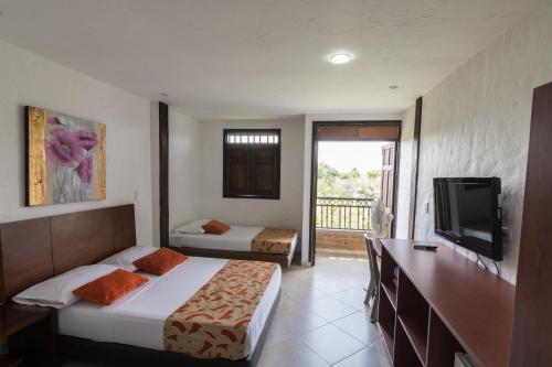 Postel nebo postele na pokoji v ubytování Finca Hotel La Esperanza