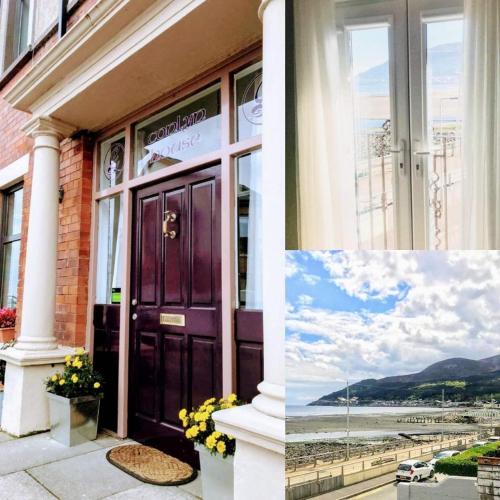 a building with a purple door and a view of the ocean at Conlyn house in Newcastle