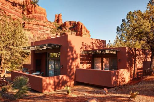 a building in the desert with a mountain in the background at Enchantment in Sedona