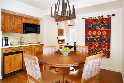 a kitchen with a wooden table with a bowl of fruit on it at Enchantment in Sedona