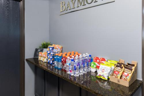 a counter with bottles of water and snacks on it at Baymont by Wyndham Morton in Morton