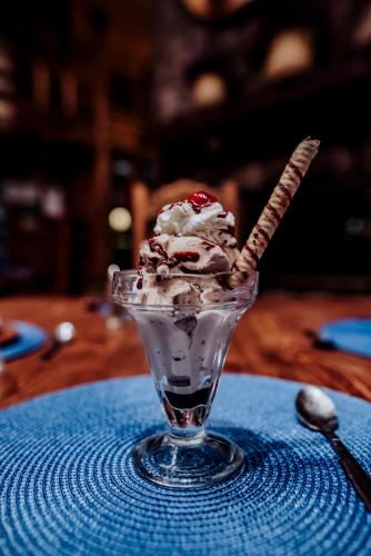 a ice cream sundae in a glass on a table at The Lodge At Creel Eco - Hotel & Spa in Creel