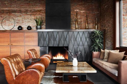 a living room with a fireplace and a couch at Enchantment in Sedona