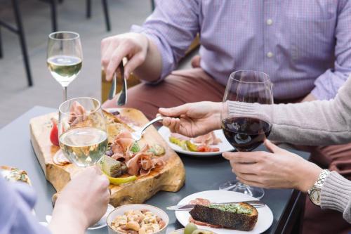 a group of people sitting at a table eating food and drinking wine at Enchantment in Sedona