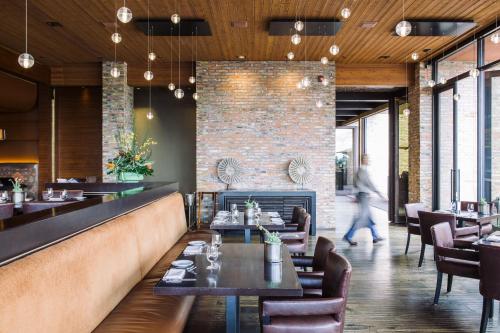 a restaurant with tables and chairs and a brick wall at Enchantment in Sedona