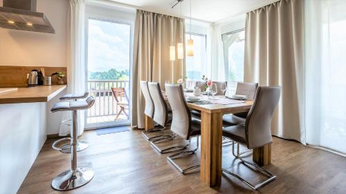 a dining room with a table and chairs at Grimming Lodge by keyone in Tauplitz