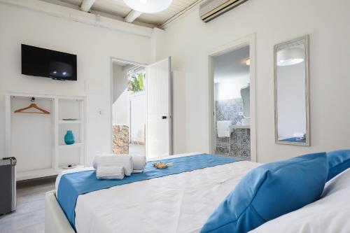 Letto o letti in una camera di I Gufi Bed & Breakfast Marzamemi