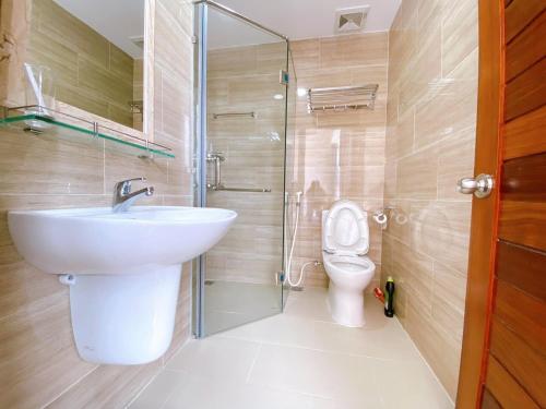 a bathroom with a sink and a toilet at John Wick 2 Apartment in Vung Tau in Vung Tau