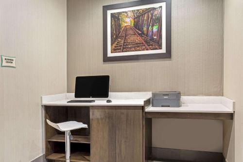a office with a desk with a laptop computer on it at La Quinta by Wyndham York in York