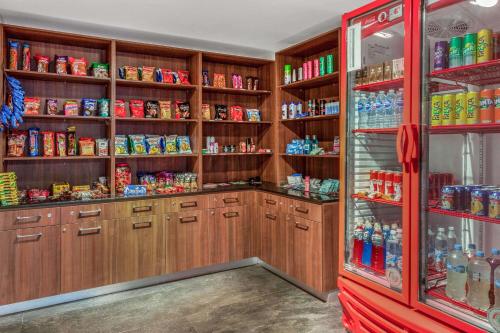 a kitchen with wooden cabinets and a lot of food at La Quinta by Wyndham San Jose Chiapa Puebla in San José Chiapa