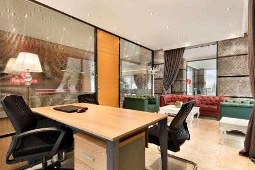 a conference room with a table and chairs at Ramada By Wyndham Giresun Piraziz in Piraziz