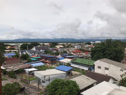 an aerial view of a town with houses and buildings at P Bliss hotel in Phayao