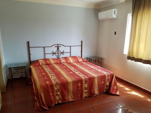 Ein Bett oder Betten in einem Zimmer der Unterkunft Hotel Playa María