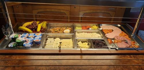 a refrigerator filled with different types of food at Hotel & Restaurant - Zum Schleicher Kuckuck in Schleich