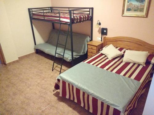 Hotel Mesón el Castilloにあるベッド