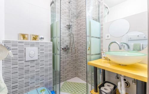 a bathroom with a glass shower and a sink at Apartments Ivka in Omiš