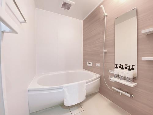 Koupelna v ubytování OUCHI HOTEL Hatsukaichi-Ekimae
