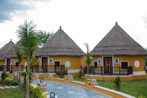 a villa with a swimming pool in a resort at Sun Hotel and Resort, Mount Abu in Ābu Road