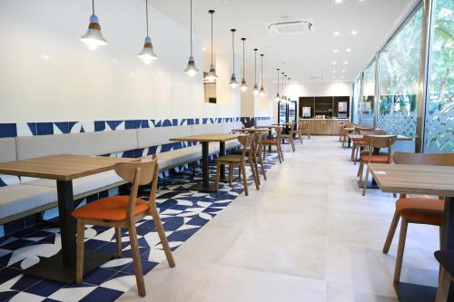 a row of tables and chairs in a restaurant at Eurosalou & Spa in Salou